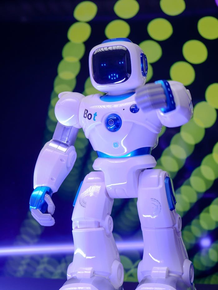 Why-Choose-Us White humanoid robot showcasing modern technology with glowing backdrop.